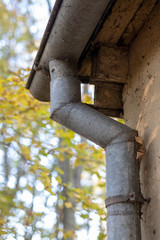Gutter draining rainwater. The building is equipped with drainage of rainwater from the roof.