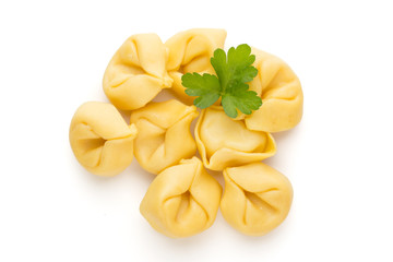 Raw homemade pasta,tortellini with herbs.