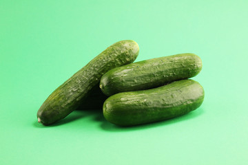 Fresh cucumbers on green. cucumbers for diet and healthy eating.