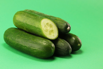 Fresh cucumbers on green. cucumbers for diet and healthy eating.