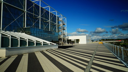 Rome, October 07, 2018: Tourists on the terrace of the New Fair of Rome, with blue sky and clouds