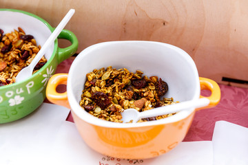 Homemade granola with nuts and seeds in thaplate for healthy breakfast