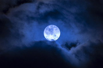 Naklejka na ściany i meble Full moon in the clouds