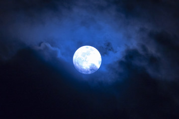 Fototapeta na wymiar Full moon in the clouds