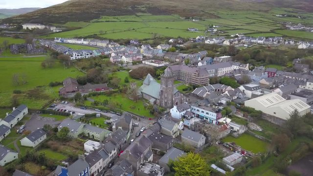 Dingle, Ireland's Church and Town With 4k Aerial Drone During the Rain Season. Rich Green Landscapes, Bright Fields and Colorful Houses Can be Seen From Above