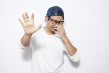 Naklejka premium Crying Sad Young Man Showing Surrender Gesture