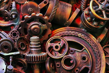 Steampunk background, machine parts, large gears and chains from machines and tractors.