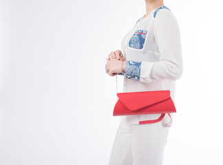 woman with red bag in her hands. on isolated background