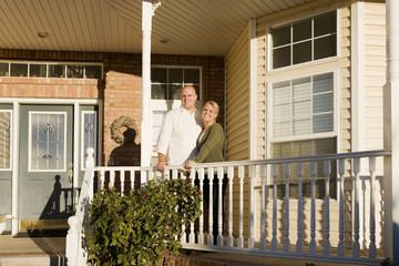 couple in front of new house