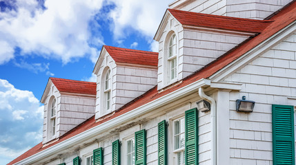 Dormers on Red Roof with Green Shutters