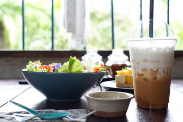 fruit salad and vegetable salad on wood table
