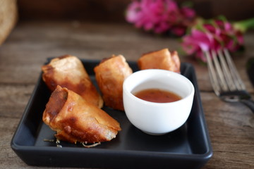 deep fried spring rolls on old wood table