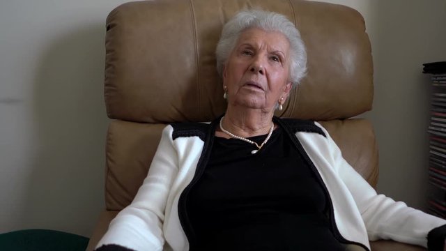 Contemplative portrait of an elderly woman.