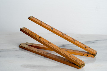 vintage carpenter's boxwood wooden folding ruler isolated on white background