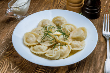 Dumplings with sour cream and herbs