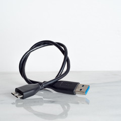 Cable connector micro-B super speed plug (right) to USB on white background