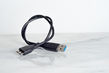 Cable connector micro-B super speed plug (right) to USB on white background