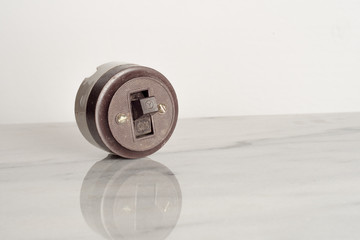 rustic and vintage bakelite ceramic switch retro style on white background