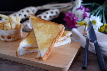 Ham and cheese sandwich on wood table