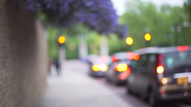 Blurred shot of cars waiting at stoplight on quiet London street