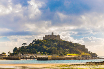 Fototapeta na wymiar Island with castle on its summit. Mont Saint Michel in Cornwall, England. With a spectacular sky and perfect light.