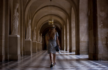 Fototapeta na wymiar Girl walking down a hallway