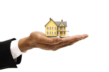 house in hands isolated on white background