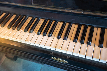 Fototapeta na wymiar Close up on old vintage piano keys