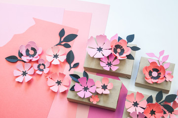 Packing a festive box with ribbons and flowers