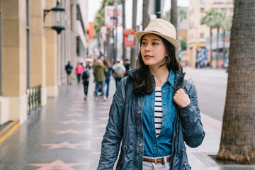 Fototapeta premium an elegant woman looking inside the show window