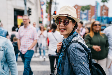 tourist turning back her head and smile to camera