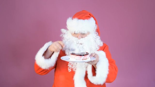 Funny santa eating cake