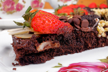 Delicious homemade brownie cake with strawberries. Selective focus