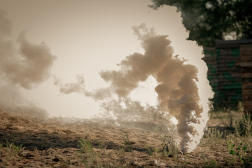 Smoke grenade explosion on polygon during lasertag game