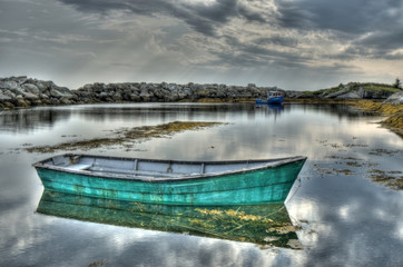 Blue Rocks Skiff with water reflection
