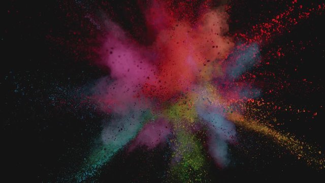 Ultra slowmotion shot of color powder explosion isolated on black background. Shot with high speed cinema camera at 1000fps