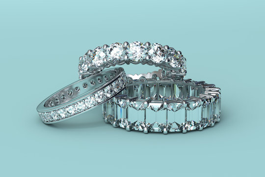 Three eternity wedding rings on tiffany blue background. 3D rendering