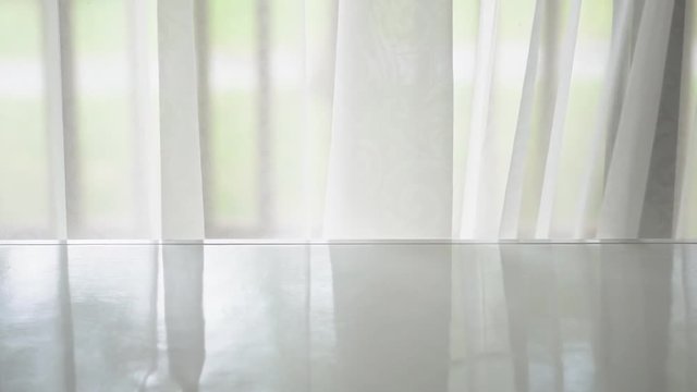 top and side or 45 degrees view white wood table or empty desk front window and wind blow the translucent white curtain sway at work home office for place product or object and background or scene
