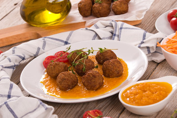 Meatballs with mashed carrots.