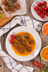Meatballs with mashed carrots.