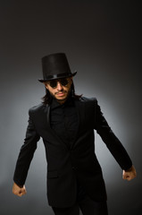 Vintage concept with man wearing black top hat