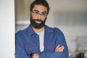 Portrait of bearded dark-haired man with blue shirt