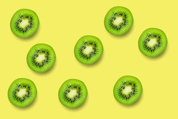 Fototapeta premium Slice of green raw kiwi fruit pattern background