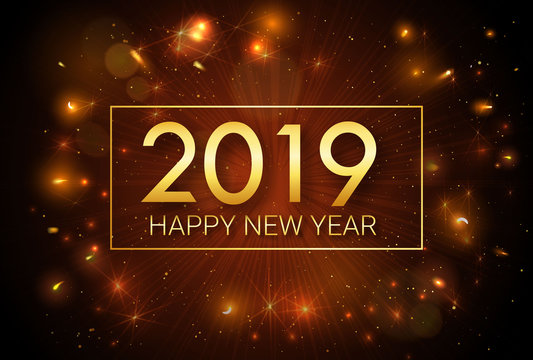 Happy New Year 2019. Greeting golden inscription on the background of fireworks. An explosion of fireworks against a dark background. Template for greeting cards, banners, invitations.