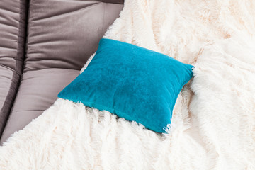 Blue pillow and blanket on the chair