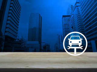 Service fix car with wrench tool flat icon on wooden table over modern office city tower and skyscraper, Business repair car concept