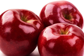 Shiny Red ripe apples, isolated on white background. Fresh raw organic fruits. Close-up