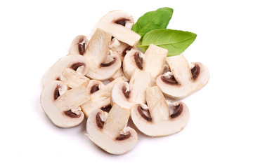 Delicious Sliced Sweden champignons with basil leaves, close-up, isolated on white background