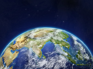 Asia on planet planet Earth in space. Extremely detailed planet surface and clouds.