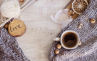 Cozy composition with coffee and knitted elements